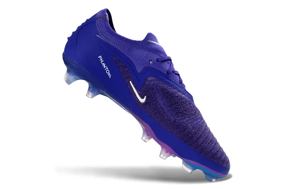 Nike Phantom 6 Elite Firm Ground Football Boots for Men on green grass by Nike
